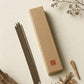 Scholar's Sandalwood focus incense box with a single stick, ivory background