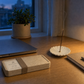 Last Light incense box with scent label closed at dusk beside notebook and lamp